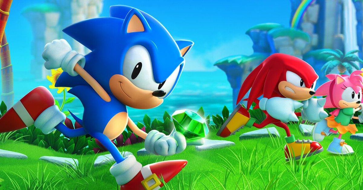 Sonic court dans l'herbe d'une île tropicale, une émeraude verte à ses pieds, suivi de Knuckles et d'Amy.